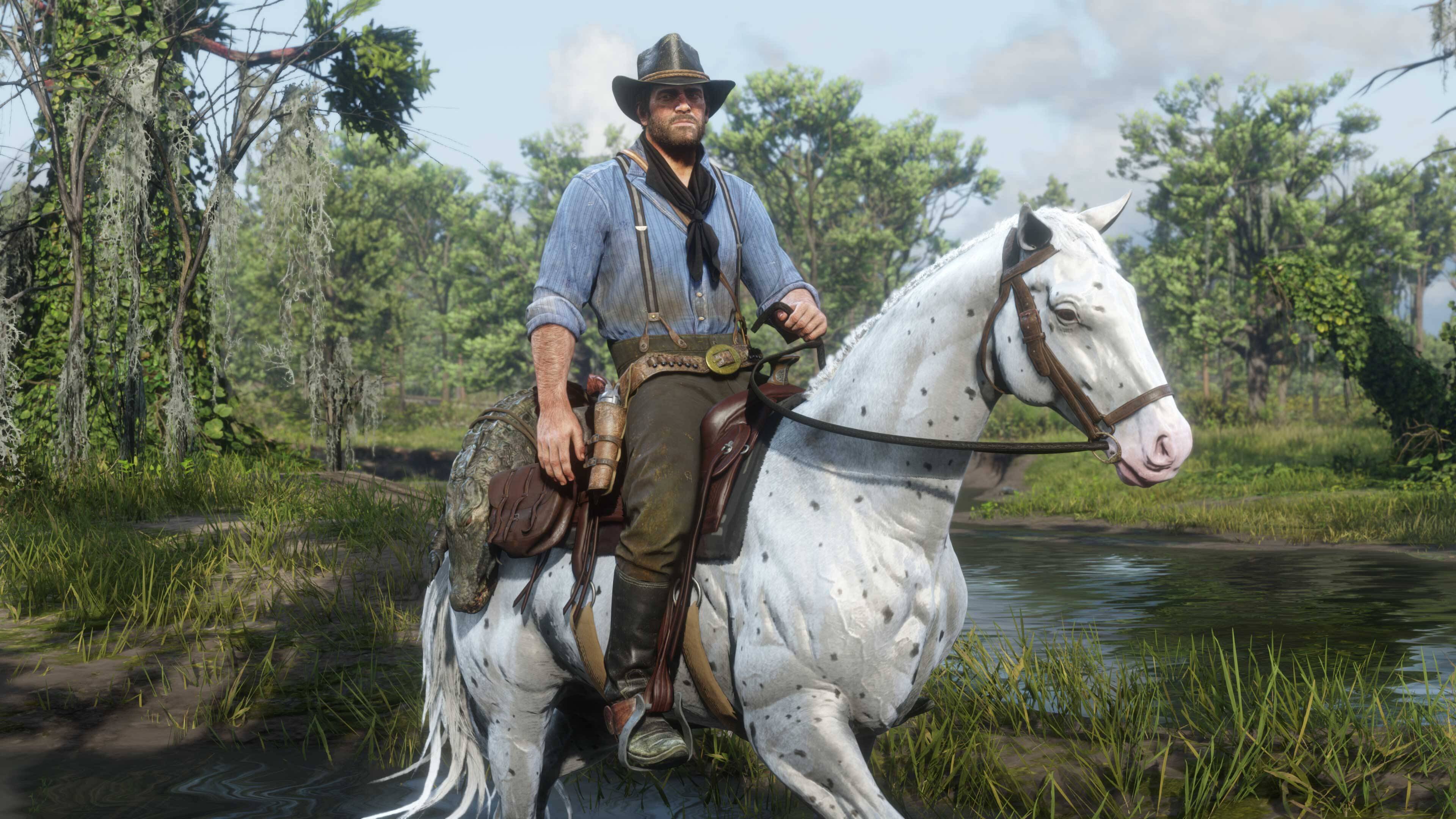 Arthur Morgan riding a white spotted horse through the swamps in Red Dead Redemption 2