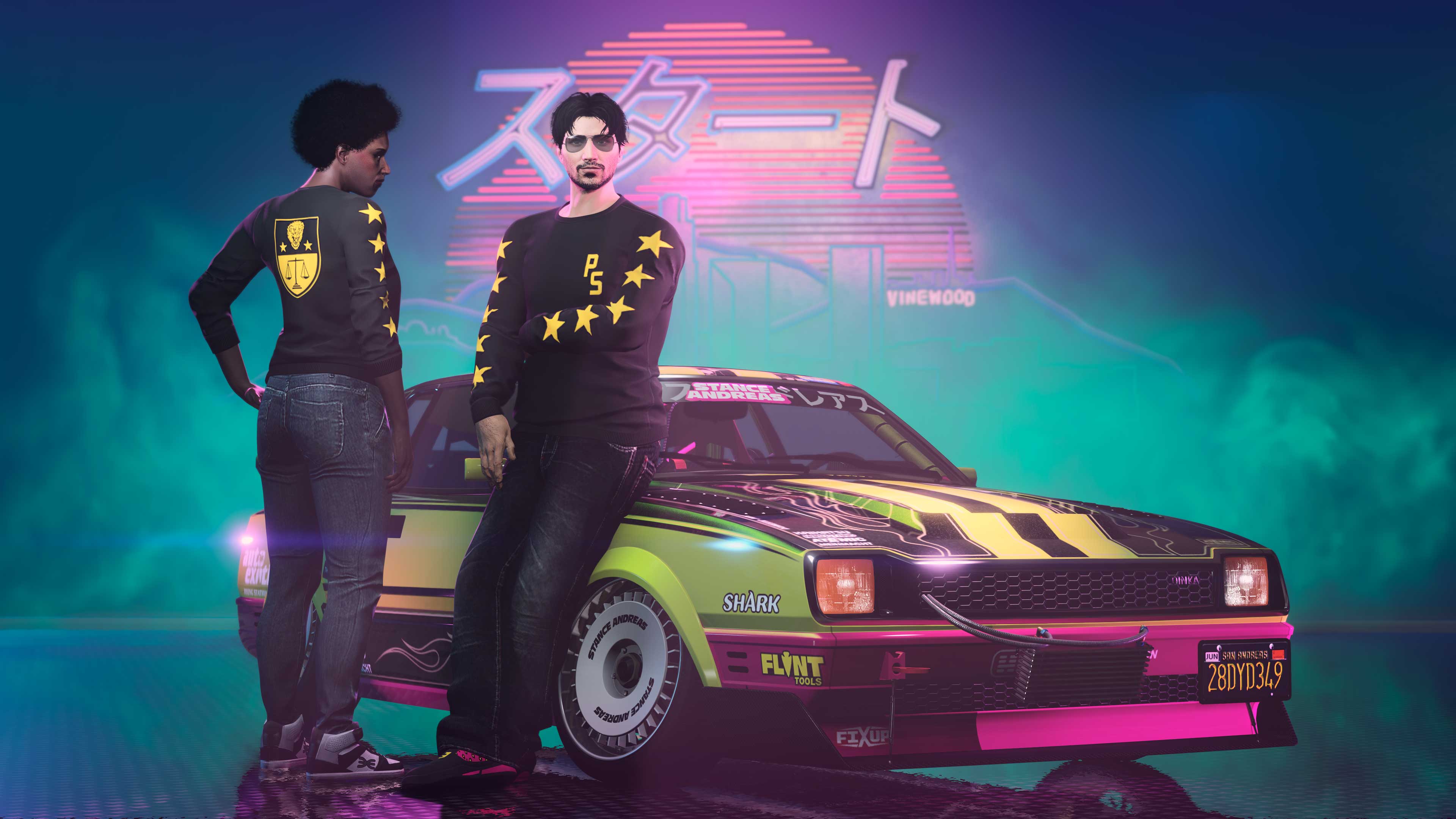 Two characters stand by a modified Dinka car as they wear the black and yellow Pacific Standard Sweater. 