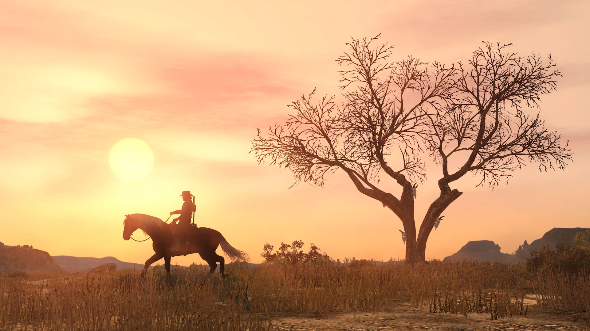 John Marston rides a cantering horse near a dead tree during a dramatic sunset.